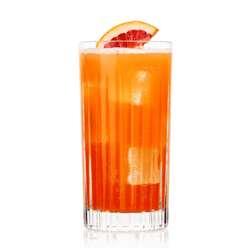 Blood Orange Crush cocktail in a Highball glass with ice garnished with a slice of blood orange.