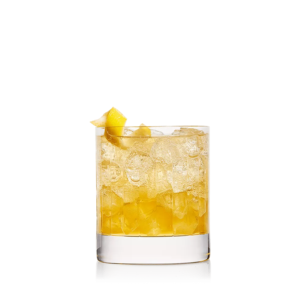 The French Twist drink in a Double Old Fashioned glass garnished with a lemon twist.
